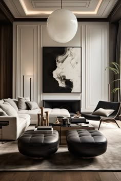 an elegant living room with black and white furniture