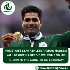 a man holding up his gold medal in front of him with the caption pakistan's star athlete ashad nadem will be given a hero welcome on his return to the country on saturday