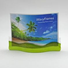 a plastic business card holder with palm trees on the beach