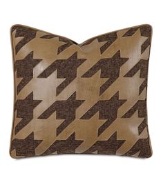 a brown and black pillow with an arrow pattern on the front, sitting on a white background