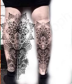 the legs are decorated with black and white tattoos on them, as well as an image of