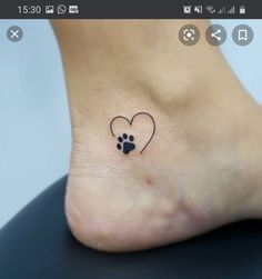 a small heart with a paw print on the side of the foot, and a dog's paw in the middle