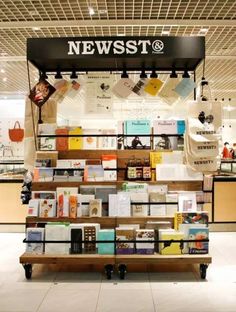 a news stand with many books on it in a store or bookstore that is open to the public