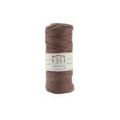 a spool of brown thread on a white background