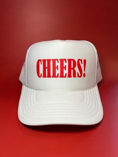 Our favorite cheers! trucker hat is perfect for this summer. You can dress it up or down and it will elevate your outfit! *THINGS TO NOTE* + Our trucker hats are made from 100% polyester with an adjustable mesh backing, making the hats both breathable and easy to find your perfect fit. + Orders only include trucker hat + One size fits most! + Message us for custom requests! Summer Party Trucker Hat, Fun Summer Snapback Dad Hat, White Funny Snapback Hat, Fun Summer Baseball Cap With Flat Bill, Summer Fun Snapback Hat With Flat Bill, Fun Summer Snapback Hat With Flat Bill, Fun Snapback Hat With Flat Bill For Summer, Fun Flat Bill Hats For Summer, Funny White Snapback Hat