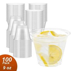 a plastic cup filled with lemon slices next to a stack of cups full of ice