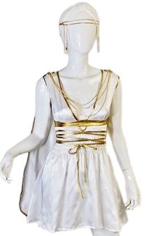 a mannequin wearing a white dress with gold chains on it's waist