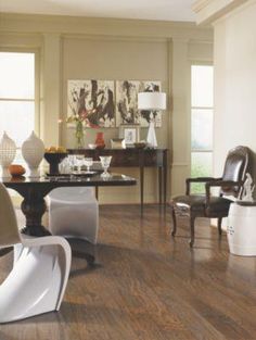 a living room filled with furniture and wooden floors