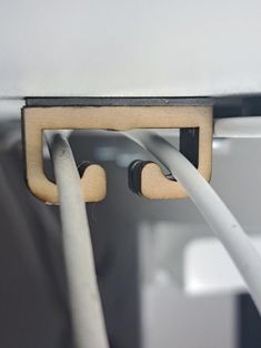 two white wires connected to an electrical outlet