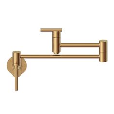 two brass faucets on the wall with one arm pointing up to the side