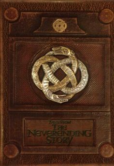 the never ending story book cover with an image of a snake and two snakes on it