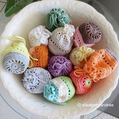 there are many crocheted balls in the bowl