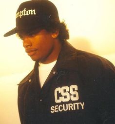 a man wearing a black hat and jacket with the word css security on it