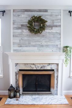 a fireplace with a wreath on the mantle