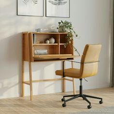 an office chair sitting in front of a desk with a book shelf and plant on it