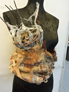 a mannequin is covered in fabric and wire