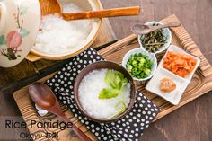 rice porridge with carrots, broccoli and other ingredients on a tray