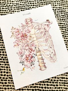 a drawing of a rib cage with flowers in it