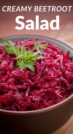 a bowl filled with red cabbage and garnish