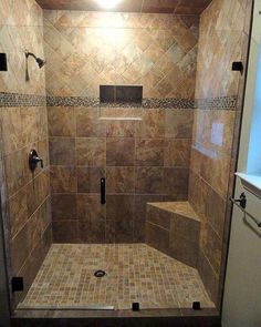 a walk in shower sitting inside of a bathroom