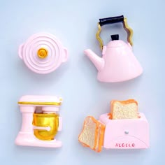 there is a toy teapot, toaster and other items