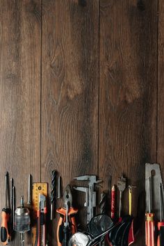 there are many different tools on the shelf together, including hammers and wrenches