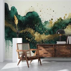 an artistic wallpaper with gold and green paint splattered on the sideboard