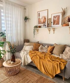 a living room filled with lots of furniture and plants on top of it's shelves