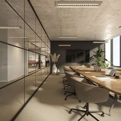 an empty conference room with wooden tables and chairs