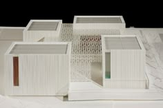 an architectural model of a white building