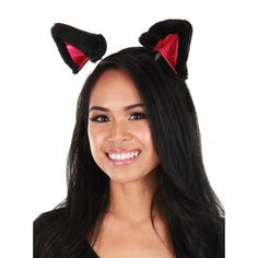 a woman with long black hair wearing cat ears