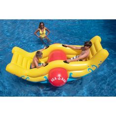 three people in an inflatable raft floating on the water