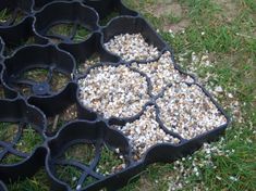 the bird seed trays are filled with birdseed and gravel to keep them from pecking