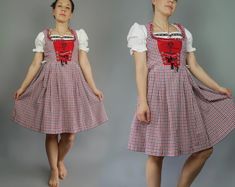 DESCRIPTION: Nice folk Bavarian style dress 90s. Bodice with lacing, blue white red gingham plaid mixed with polyester cotton fabric, pleated skirt. Top part has cotton lining. I  guess it's modern dirndl. This is really delightful dirndl dress! SIZE marked: 36 / S / Waist: 27" 69 cm  BRAND: dress: Landhaus MATERIAL: 60% cotton 40% polyester CONDITION: excellent * * * * * * m e a s u r e m e n t s * * * * * *  Bust: 34.5" 87 cm Waist: 27" 69 cm  length of top: 15 3/4"  40 cm Length: 39" 99 cm Please Bear in Mind That Colors On The Photo May Slightly Different From Actual Item Colors V I N T A G E C O N D I T I O N S: n e w: new e x c e l l e n t: very little wear, few if any noted issues, there are no holes, stains or other damages v e r y g o o d: minor wear or some small flaw, about whic Modern Dirndl, Oktoberfest Dress, Folk Dress, Dirndl Dress, Brand Dress, Folk Dresses, 90s Dress, Red Gingham, Gingham Dress