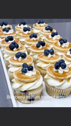 blueberry muffins topped with mini pancakes and whipped cream are ready to be eaten