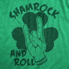 a green shirt with the words rock and roll written on it