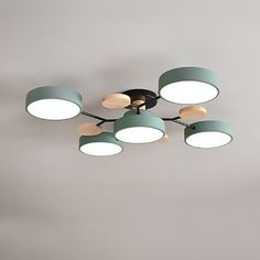 a ceiling light with six circular lights on it