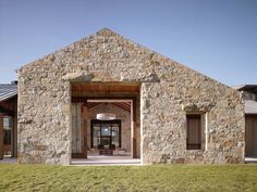 a stone building with an open front door