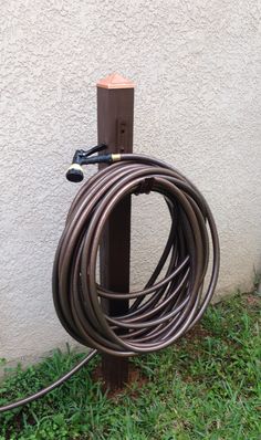 a garden hose is attached to the side of a building