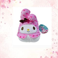 a hello kitty stuffed animal with a pink bow on it's head