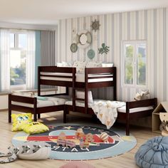 a bedroom with bunk beds and toys on the floor in front of striped wallpaper