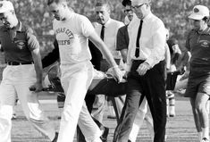 a group of men walking across a field