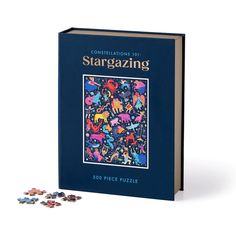 a book with puzzle pieces in front of it and the title stargazing on top