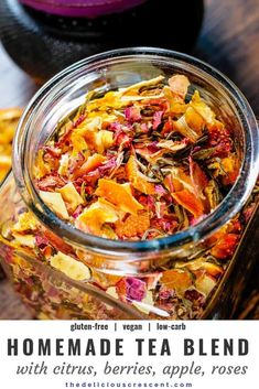 homemade tea blend with citrus, berries, apple, and rose petals in a glass jar