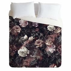 an image of a bed with flowers and leaves on the comforter cover that has been made to look like it is blooming