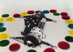 a woman laying on the ground surrounded by colorful circles