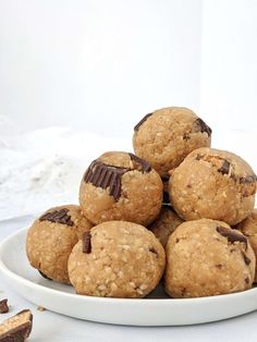 a white plate filled with cookies on top of a table next to some chocolate chips