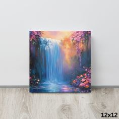 a painting of a waterfall surrounded by pink flowers on a white wall next to a wooden floor