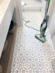 a tile floor with a vacuum on it