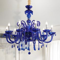 a blue chandelier hanging from the ceiling